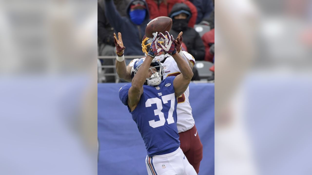 Washington Redskins wide receiver Maurice Harris (13) gets tackled