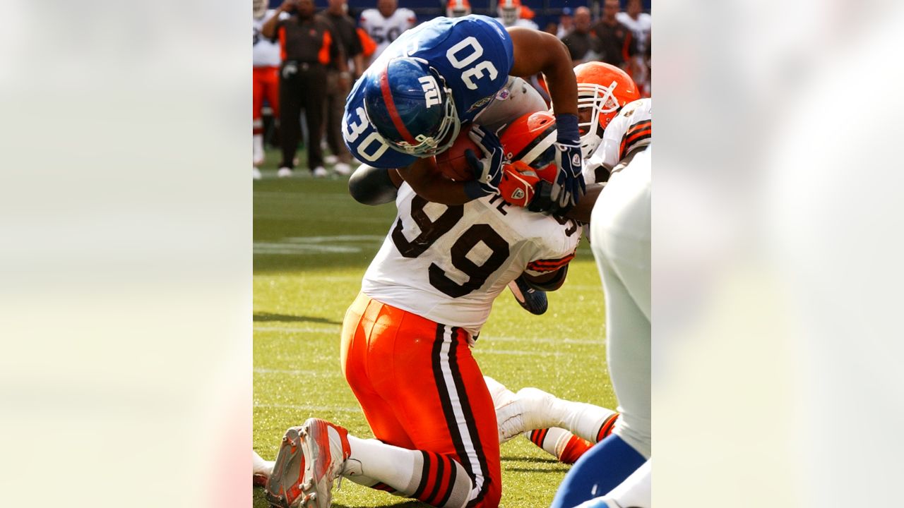 Bulldogs in the NFL - Image 34: Cleveland Browns running back Nick Chubb  (left) and his cousin Denver Broncos outside linebacker Bradley Chubb  (right) exchange jerseys following the game at Broncos Stadium