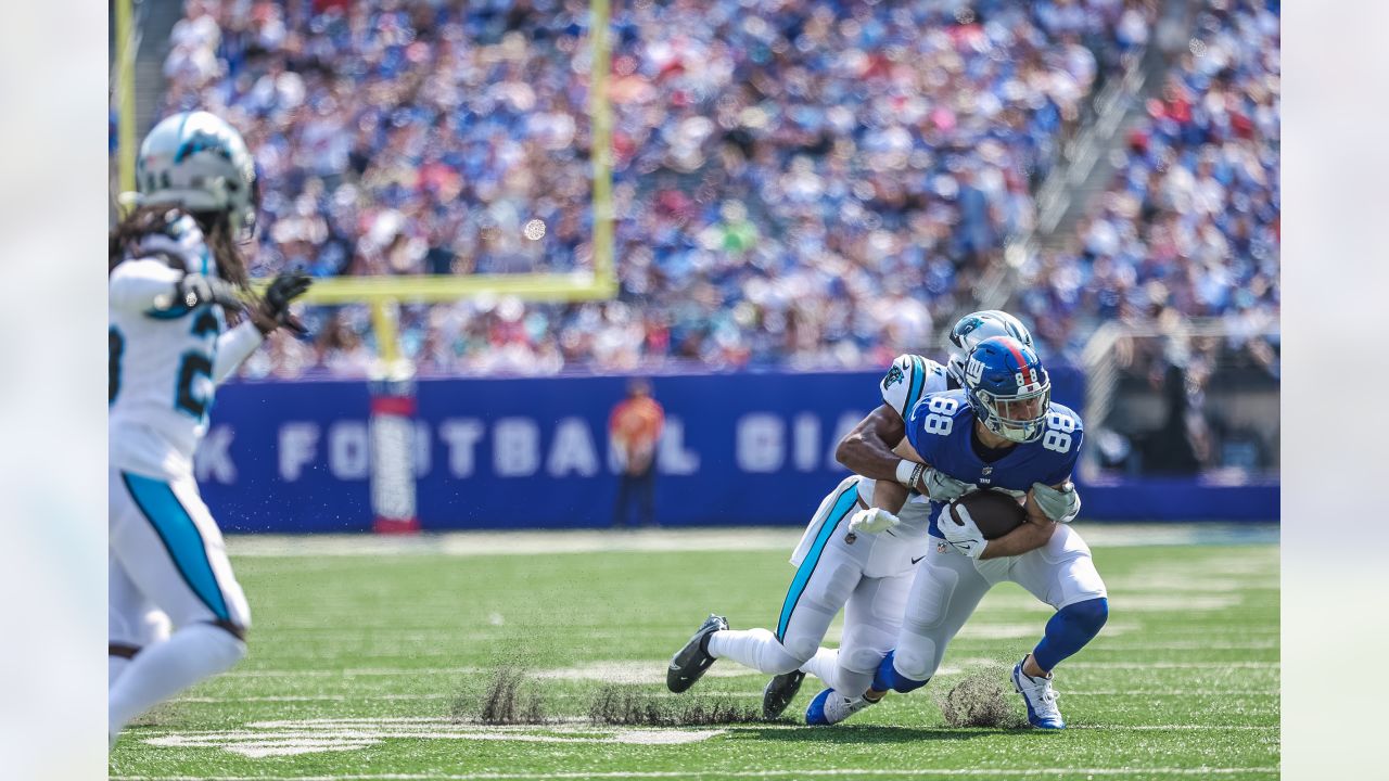 Carolina Panthers' Jeremy Chinn, left, tries unsuccessfully to stop New  York Giants' Daniel Bellinger from scoring a touchdown during the second  half an NFL football game, Sunday, Sept. 18, 2022, in East