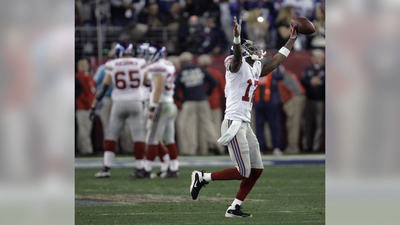 FILE - In a Feb. 3, 2008, file photo, New York Giants receiver Plaxico  Burress (17) makes a touchdown reception in the fourth quarter during the Super  Bowl XLII football game against