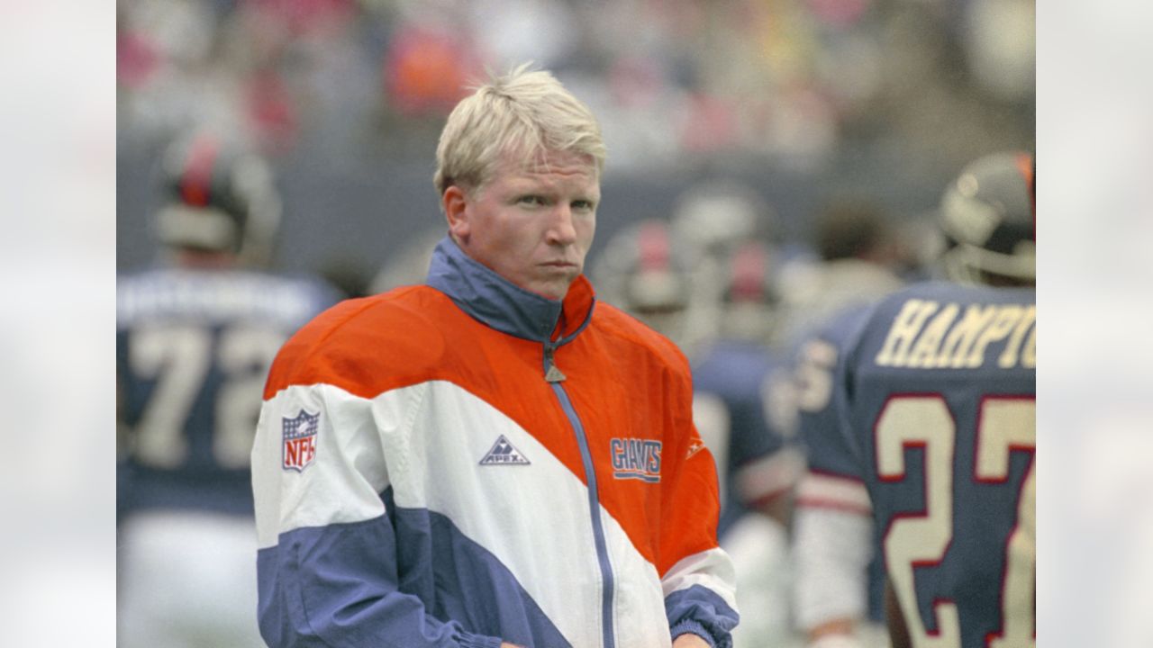 Former New York Giants Phil Simms waves to fans as he is inducted into the  Giants Ring of Honor at New Meadowlands Stadium in East Rutherford, New  Jersey, Sunday, October 3, 2010. (