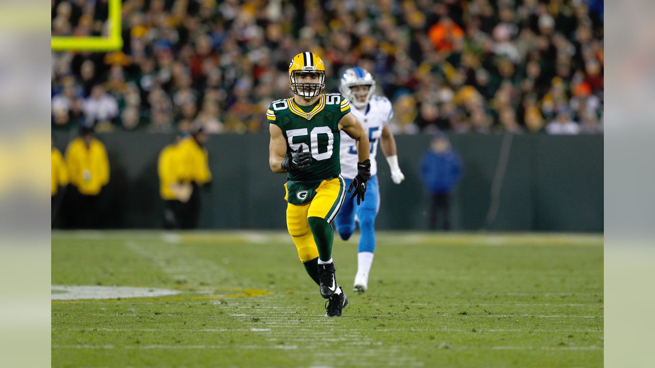 GREEN BAY, WI - OCTOBER 16: New York Jets defensive end Jacob Martin (54)  chases down Green Bay Packers quarterback Aaron Rodgers (12) during a game  between the Green Bay Packers and