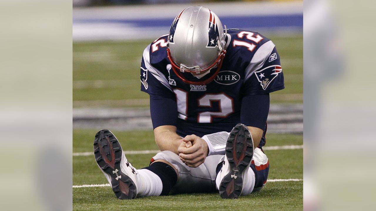 New England Patriots quarterback Tom Brady (12) gives wide recceiver Randy  Moss (81) a high five after Brady scored in the third quarter against the  Washington Redskins at Gillette Stadium in Foxboro