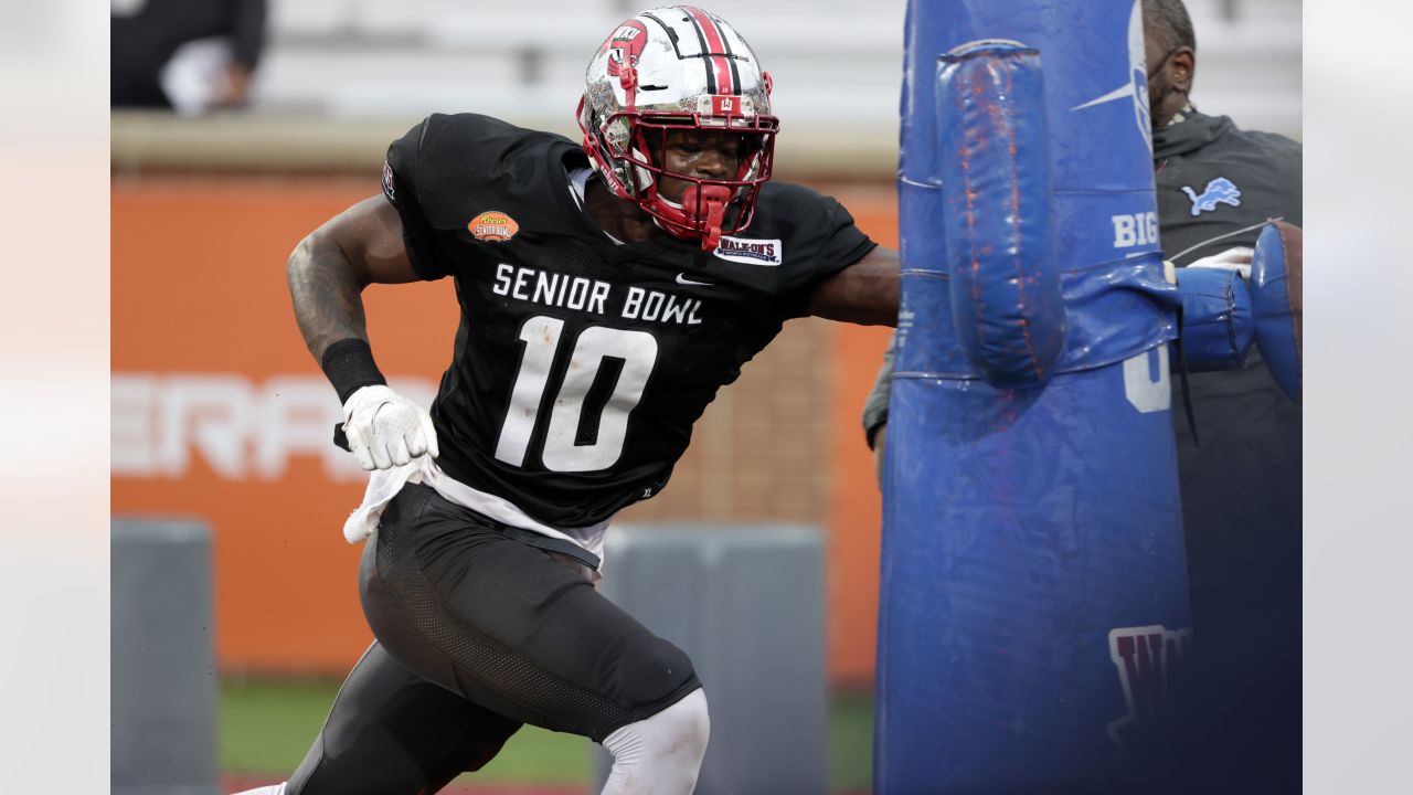 American Team defensive lineman DeAngelo Malone of Western Kentucky (10)  runs through drills during practice for