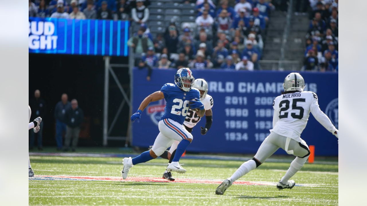 Las Vegas Raiders' Tyree Gillespie (37) tackles New York Giants' Pharoh  Cooper (83) during the …