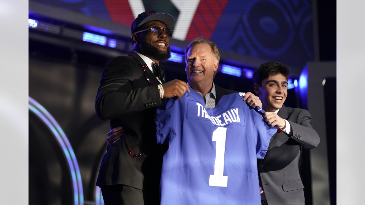 Alabama wide receiver Jameson Williams stands with NFL Commissioner Roger  Goodell after being chosen by the Detroit Lions with the 12th pick of the  NFL football draft Thursday, April 28, 2022, in