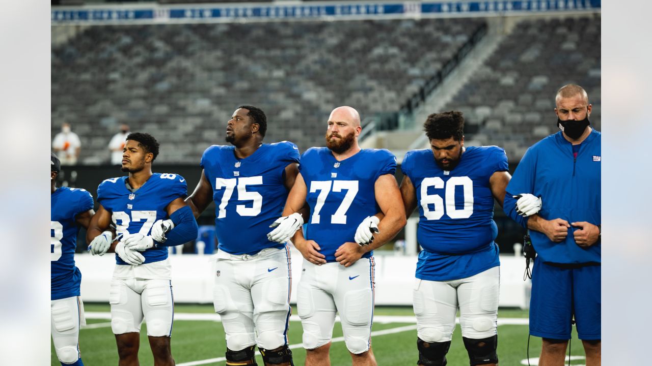 New York Giants linebacker Carter Coughlin (52) walks off the field after  an NFL football game against the Washington Commanders Sunday, Dec. 4,  2022, in East Rutherford, N.J. (AP Photo/Adam Hunger Stock