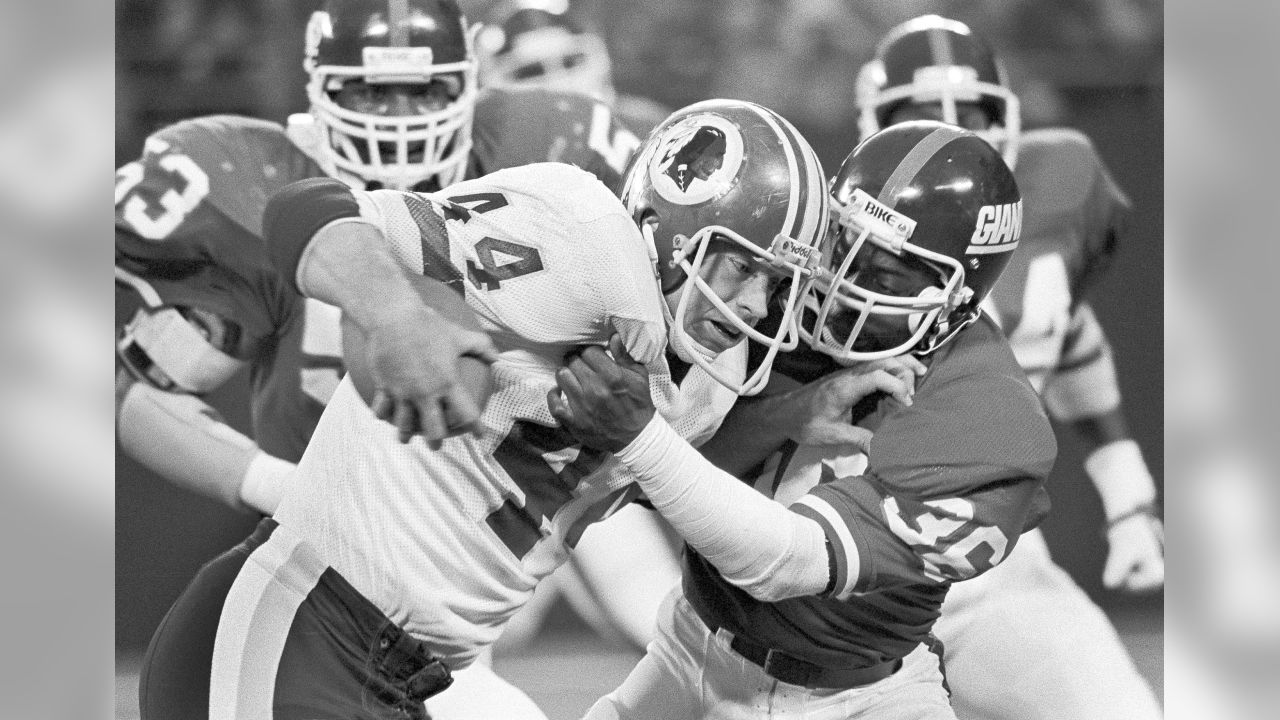 Washington Commanders running back Antonio Gibson is tackled by Tennessee  Titans defenders in the second half of an NFL football game, Sunday, Oct.  9, 2022, in Landover, Md. (AP Photo/Alex Brandon Stock