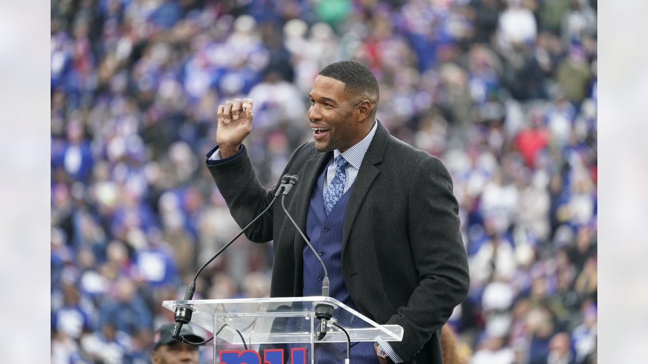 New York Giants Michael Strahan walks away from the podium after his  retirement press conference at Giants Stadium in East Rutherford, New Jersey  on June 6, 2008. Strahan retires after 15 years