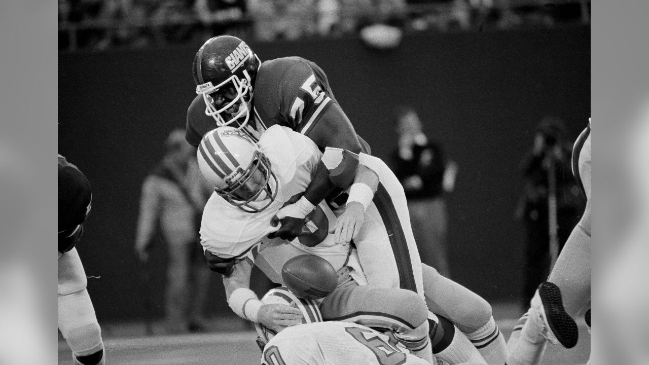 Quarterback Archie Manning of the Houston Oilers loses the ball as