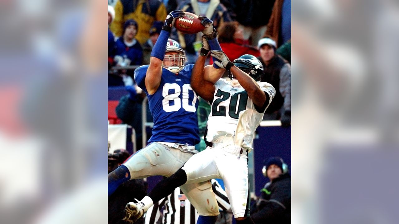 Philadelphia Eagles Brian Dawkins makes an interception over New York  Giants Plaxico Burress in the 2nd quarter at Giants Stadium in East  Rutherford, New Jersey on December 17, 2006. The New York