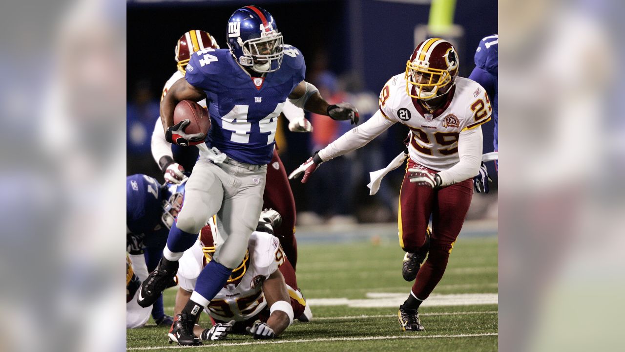 New York Giants running back Ahmad Bradshaw (44) flexes after rushing for a  first down during first half week 13 NFL action between the New York Giants  and Washington Redskins at New