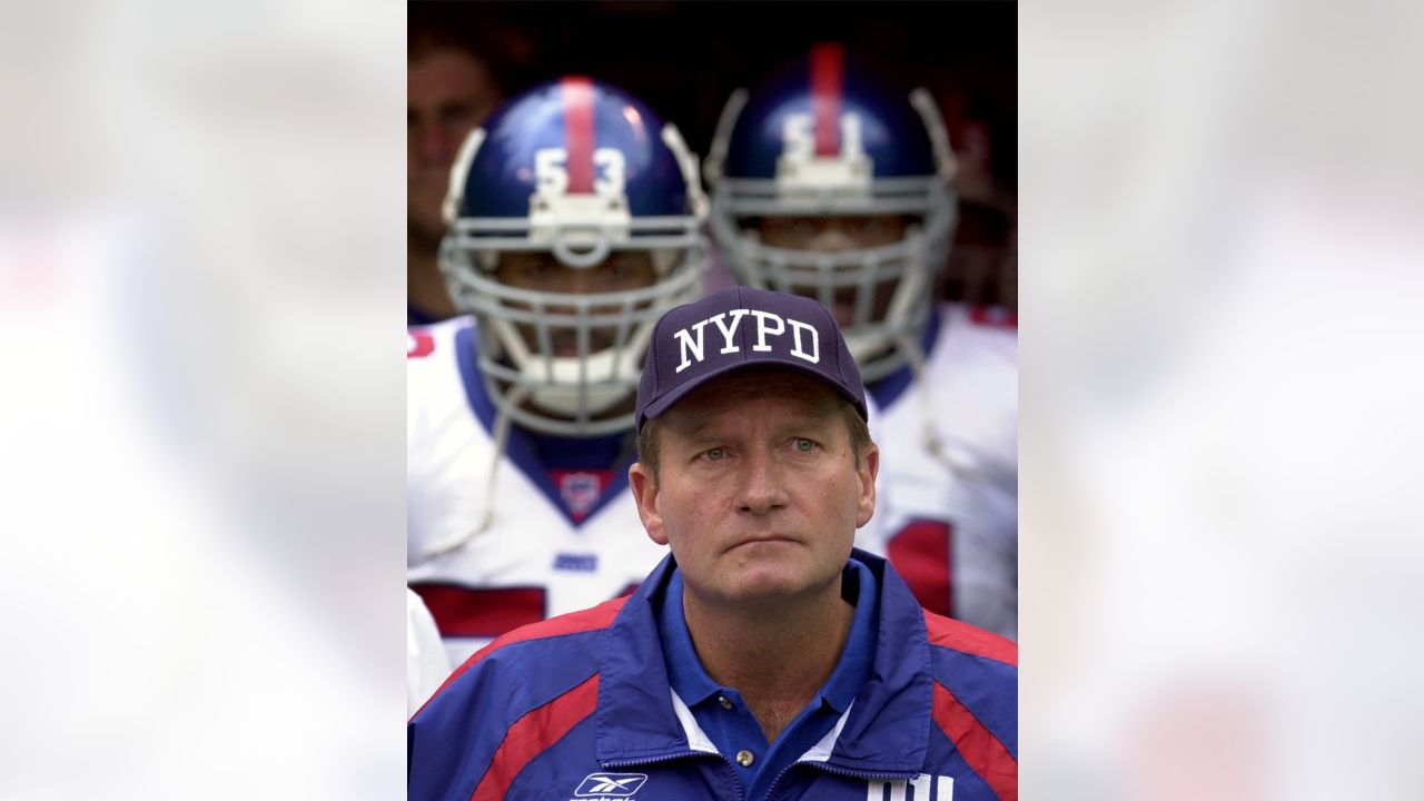 New York Giants head coach Jim Fassel wears his 2000 Super Bowl