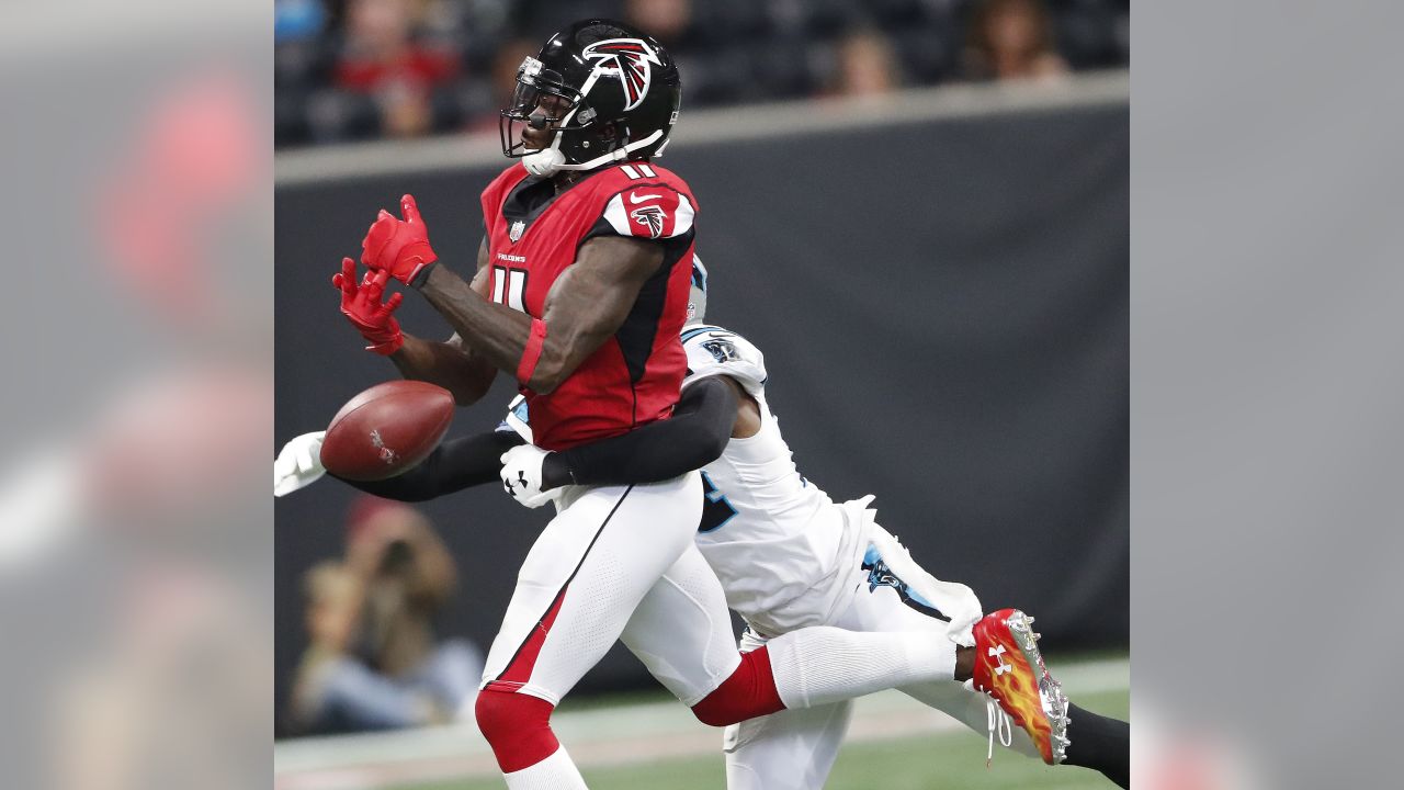 Atlanta Falcons' Julio Jones (11) is tackled by Carolina Panthers' Luke  Kuechly (59) during the first