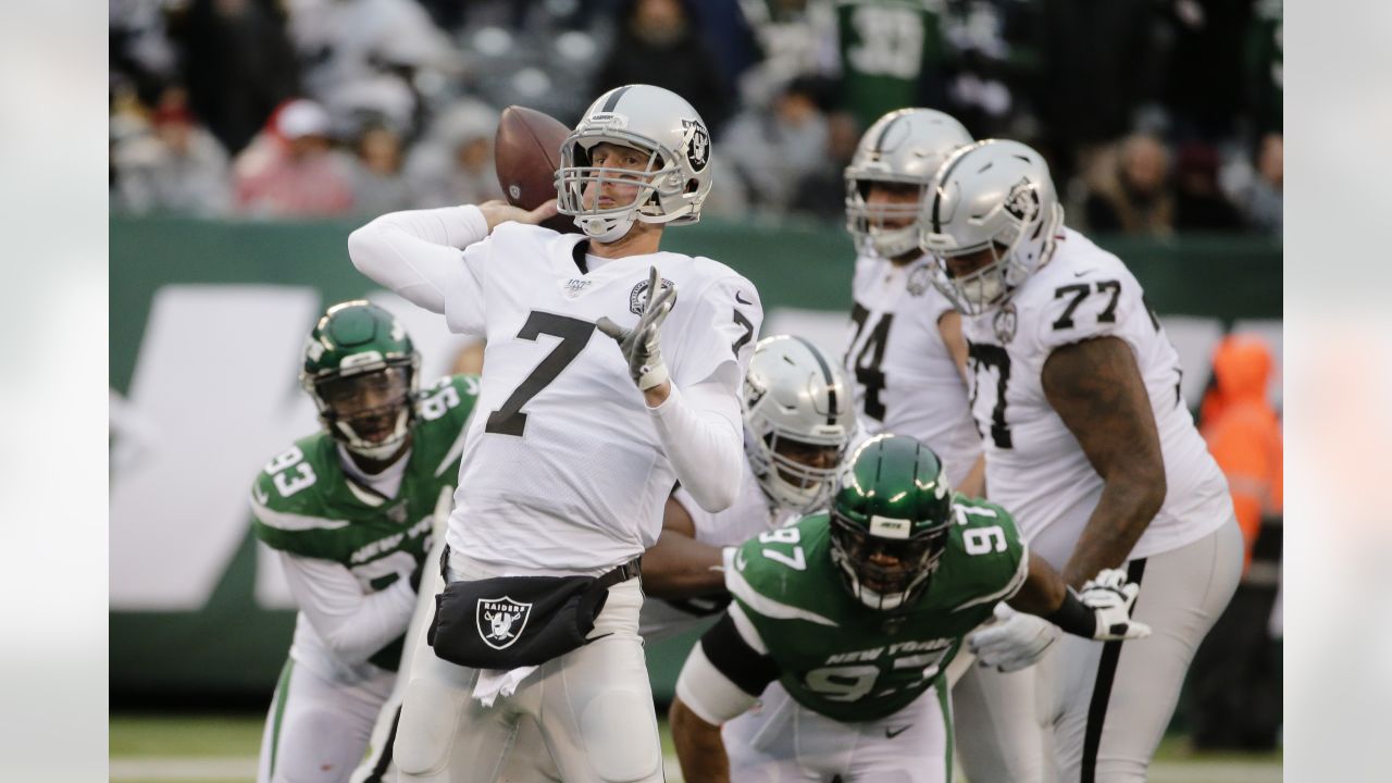 Oakland Raiders quarterback Mike Glennon (7) calls a play from the huddle  during the second hal …