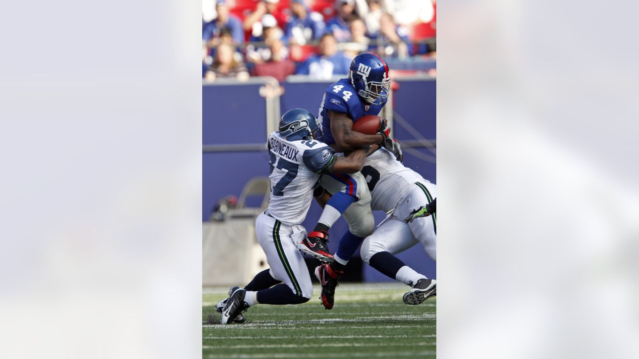 New York Giants defender Michael Strahan looks dejected while waiting on  the sidelines. The Detroit Lions defeated the New York Giants 28 to 13 at  Giants Stadium in East Rutherford, New Jersey