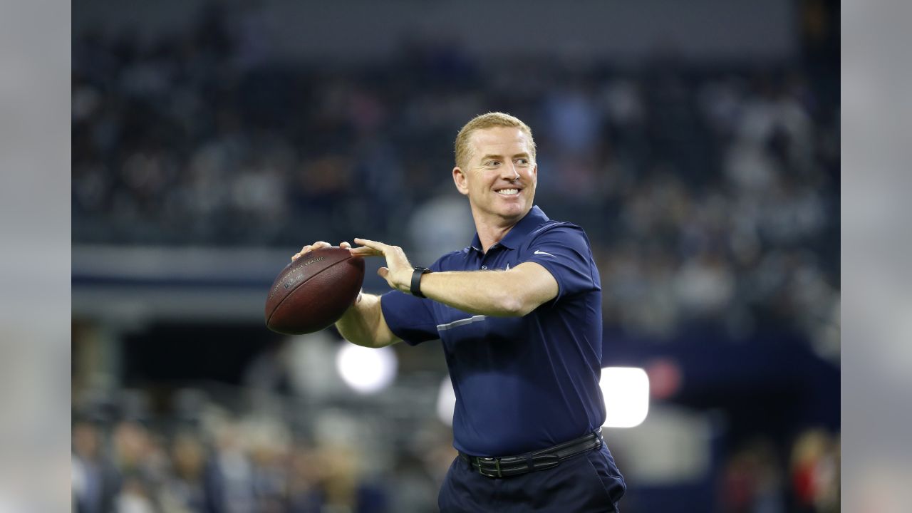 Dallas Cowboys head coach Jason Garrett talks to staff on the sideline  during warm ups before a preseason NFL football game against the Oakland  Raiders on Saturday, Aug. 26, 2017, in Arlington