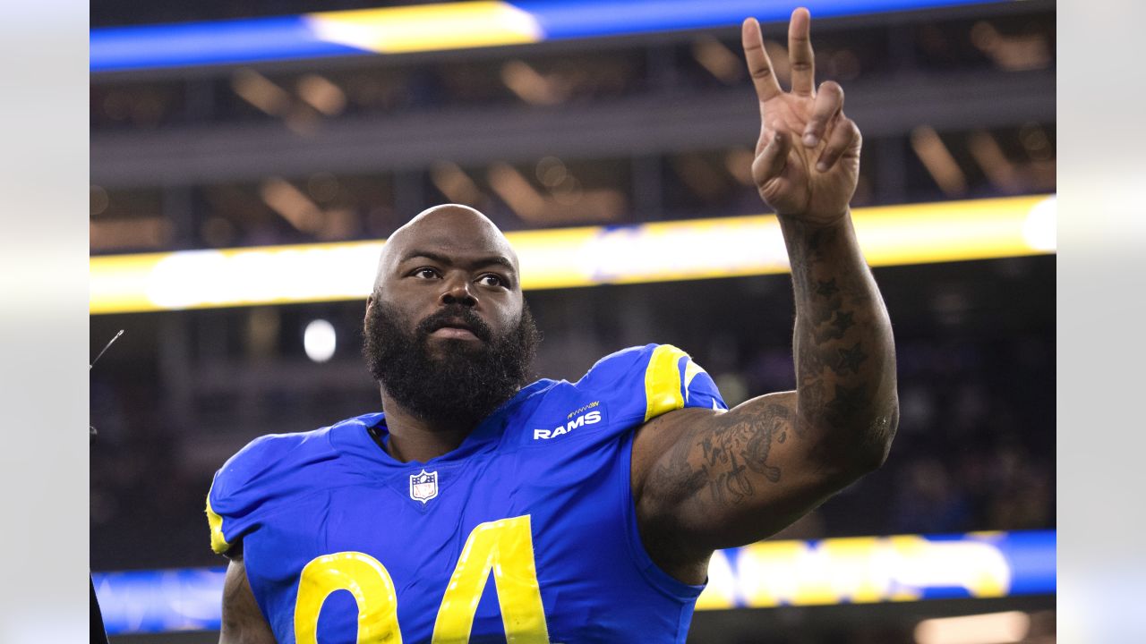 Los Angeles Rams defensive end Aaron Donald (99) celebrates during the first  half of an NFL wild-card playoff football game against the Arizona  Cardinals in Inglewood, Calif., Monday, Jan. 17, 2022. (AP