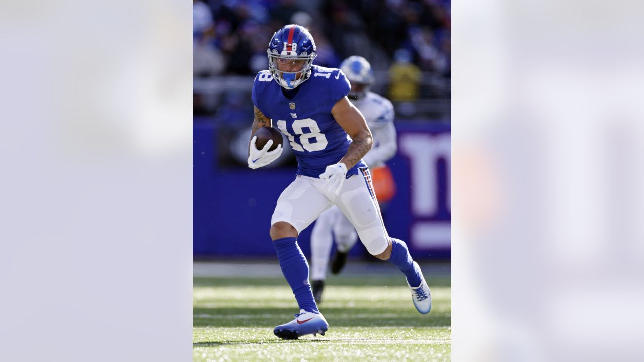 New York Giants wide receiver Isaiah Hodgins (18) runs with the ball  against the Washington Commanders during an NFL football game Sunday, Dec.  4, 2022, in East Rutherford, N.J. (AP Photo/Adam Hunger