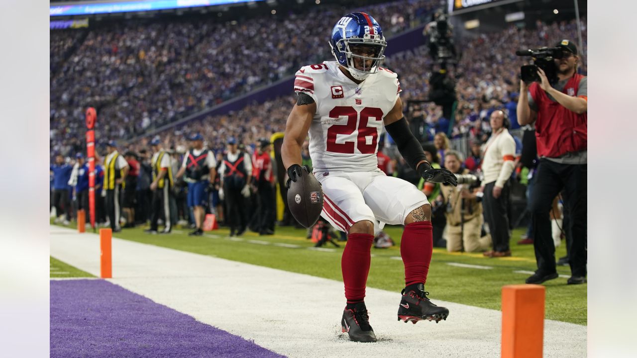 New York Giants' Isaiah Hodgins catches a pass between Minnesota Vikings'  Chandon Sullivan and Duke Shelley during the first half of an NFL wild card  football game Sunday, Jan. 15, 2023, in