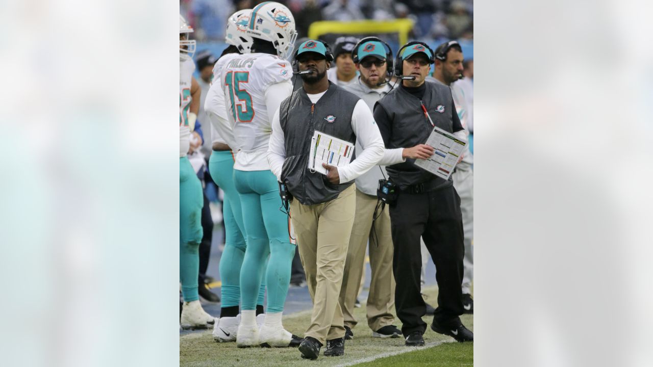 Los Angeles Chargers head coach Anthony Lynn, center, reacts on the  sideline after a replay is shown on a stadium video monitor during the  second half of an NFL football game against