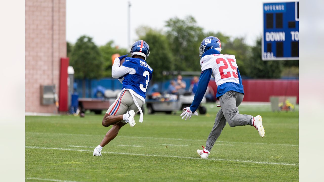 New York Giants cornerback Deonte Banks (36) smiles as he walks off the  training field at