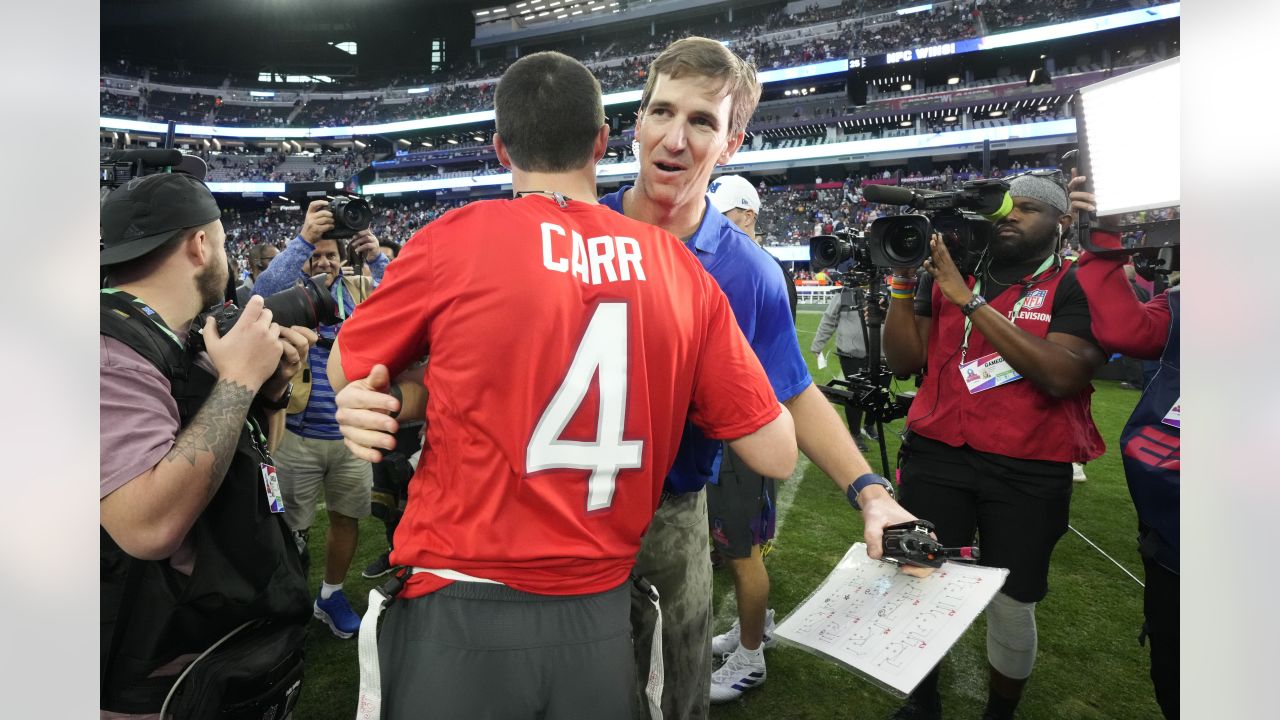 AFC quarterback Derek Carr (4) of the Las Vegas Raiders talks with head  coach Peyton Manning during the flag football event at the NFL Pro Bowl,  Sunday, Feb. 5, 2023, in Las