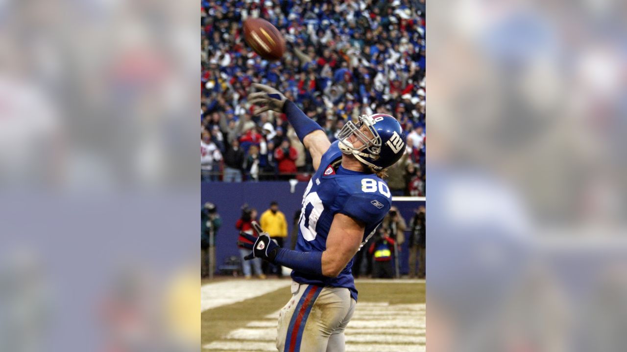 Buffalo Bills Aaron Schobel (94) leaps in the air to stop New York Jets  Thomas Jones (20) in the third quarter at Giants Stadium in East  Rutherford, New Jersey on October 28