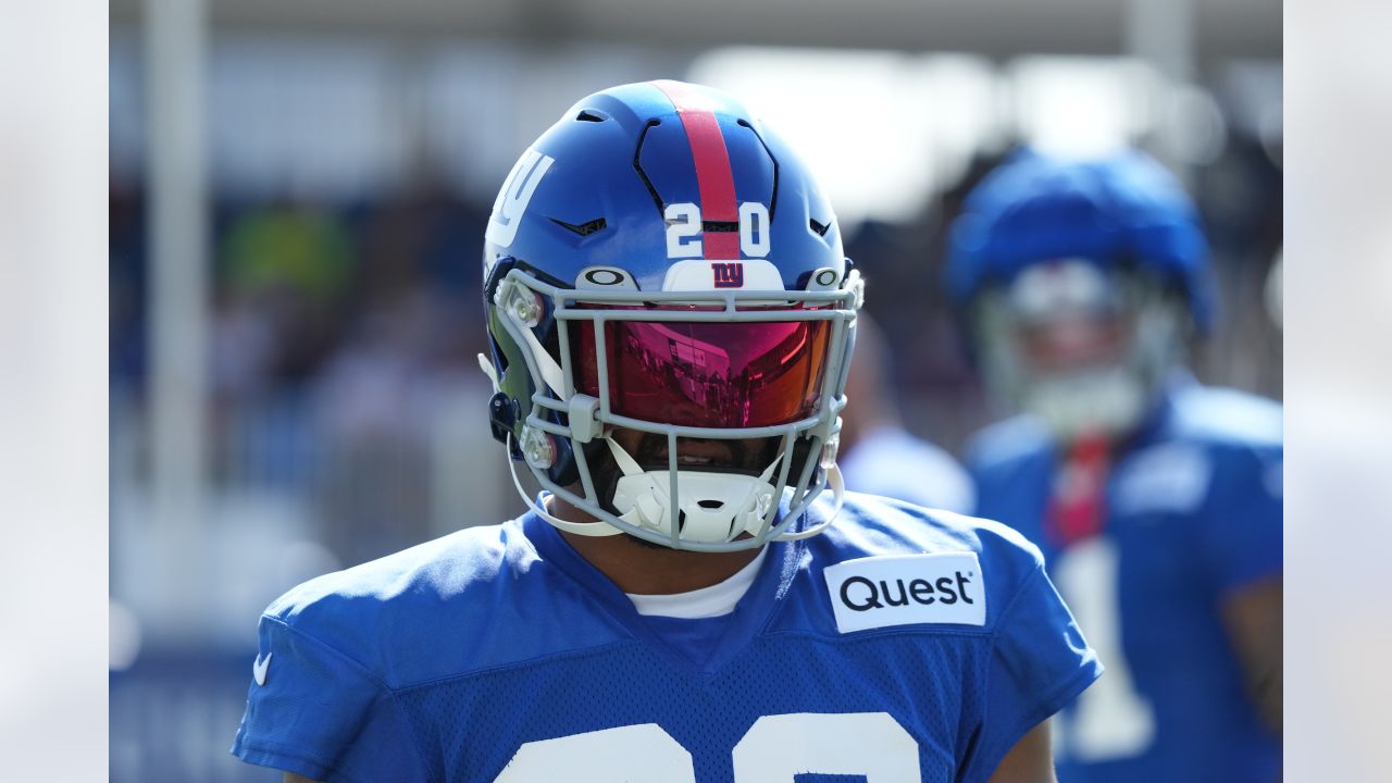 New York Giants tackle Evan Neal #73 walks off the field after