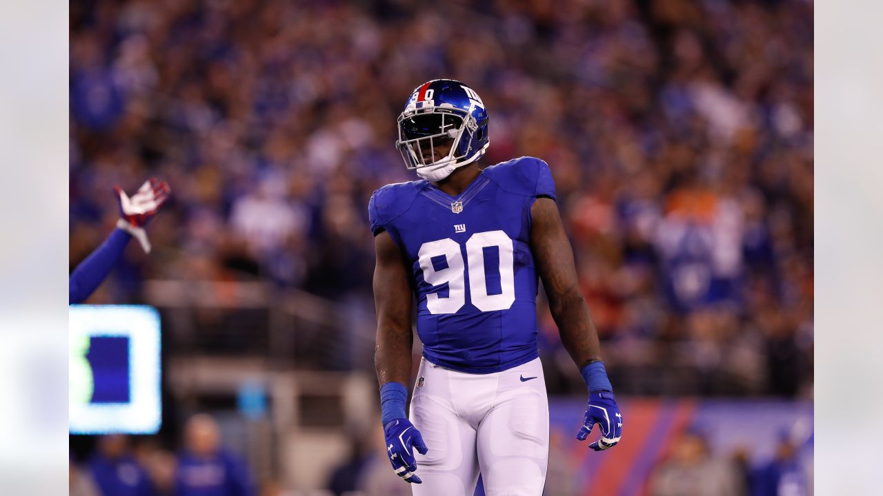 New York Giants defensive end jason Pierre-Paul stands over a fallen New  England Patriots quarterback Tom Brady during the fourth quarter at Super  Bowl XLVI at Lucas Oil Stadium on February 5