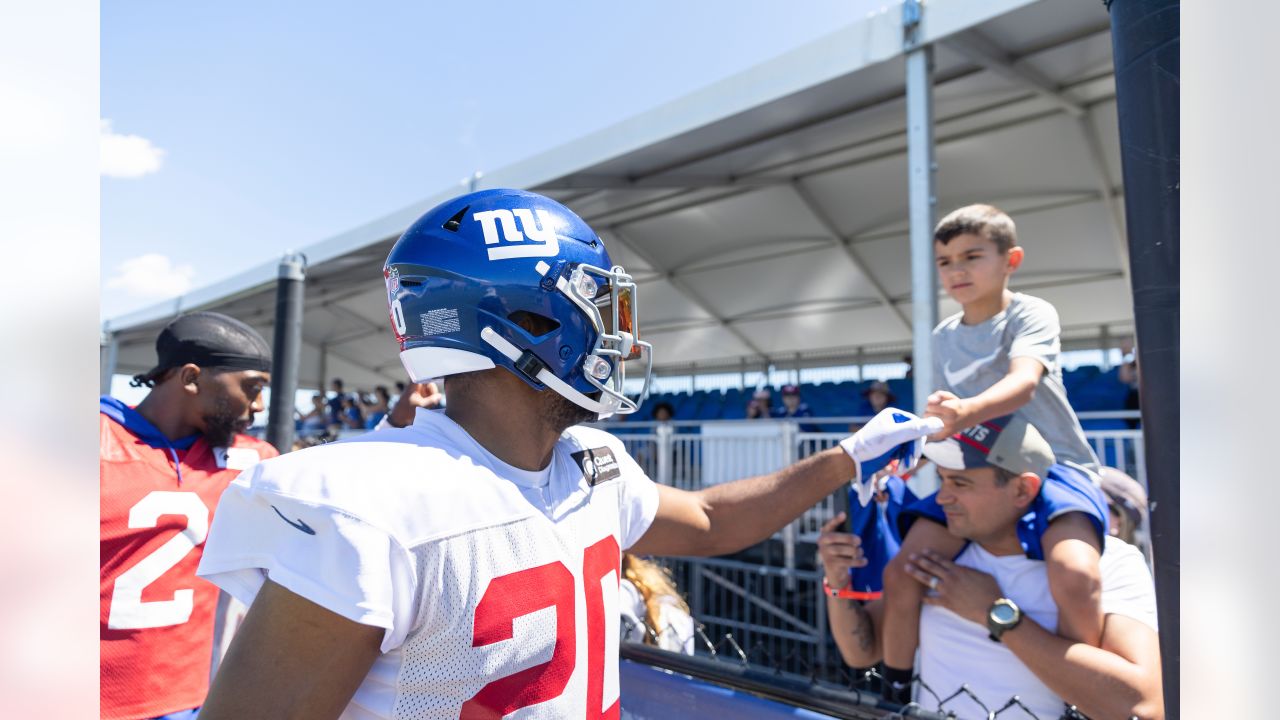 New York Giants tackle Evan Neal #73 walks off the field after their 31-27  loss to the New York Jets in an NFL pre-season football game, Sunday, Aug.  27, 2022, in East