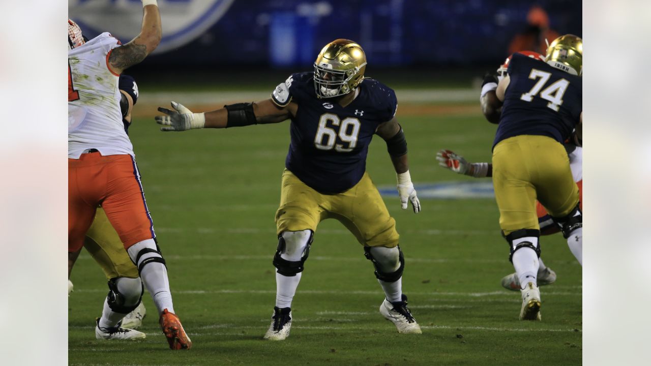 Miami Dolphins offensive tackle Liam Eichenberg (74) and offensive tackle Robert  Hunt (68) walk onto the field during the second half of an NFL football  game against the New York Jets, Sunday