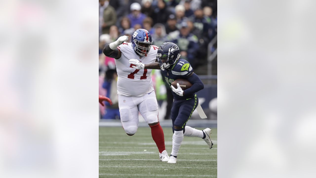 Seattle Seahawks wide receiver Deion Branch is tackled by New York Giants  safety Jason Bell after Branch made a catch in the first quarter of a NFL  football game Sunday, Sept. 24