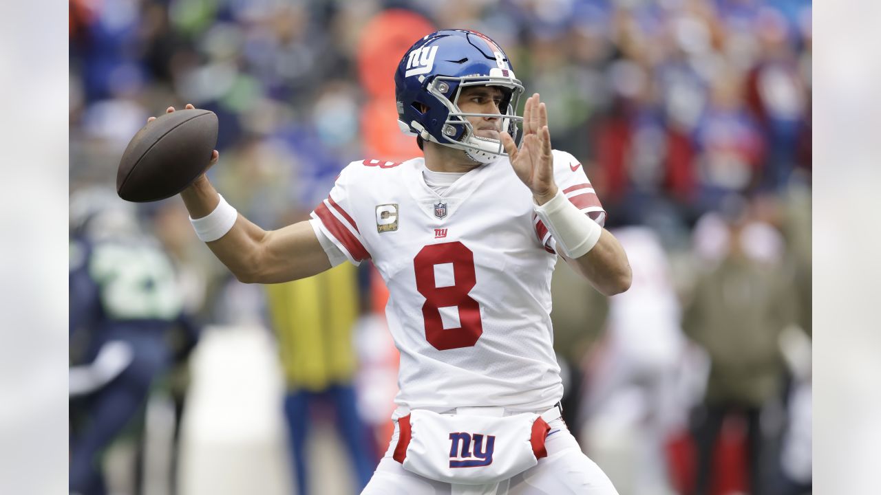 New York Giants quarterback Daniel Jones (8) passes against Seattle  Seahawks linebacker Uchenna Nwosu (10) as offensive tackle Andrew Thomas,  second from right, blocks defensive end Shelby Harris (93) during the second