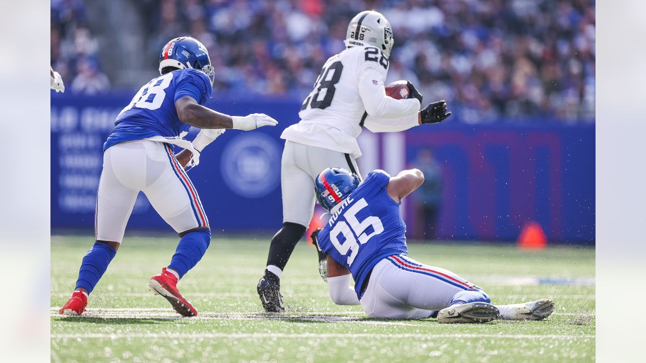 New York Giants fullback Elijhaa Penny (39) and defensive back Steven  Parker (38) react after a defensive play against the Washington Football  Team during the first quarter of an NFL football game, Sunday, Jan. 9,  2022, in East Rutherford, N.J. (AP Pho