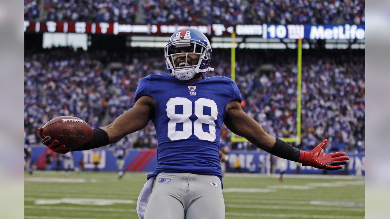 New York Giants wide receiver Hakeem Nicks and New York Jets Antonio  Cromartie grab jerseys in the second quarter in week 1 of the NFL Preseason  at The New Meadowlands Stadium in