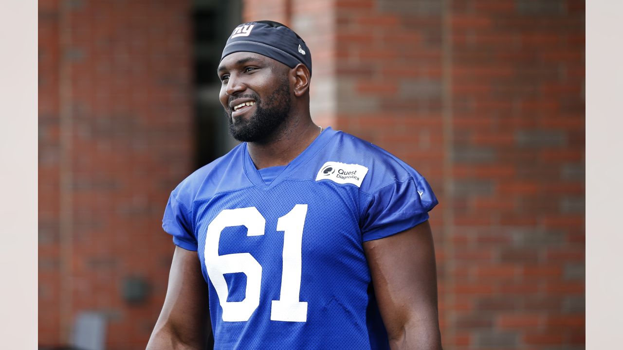 New York Giants offensive tackle Roy Mbaeteka (61) on the sideline during  the first half of an NFL football game against the New York Giants,  Thursday, Aug. 11, 2022, in Foxborough, Mass. (