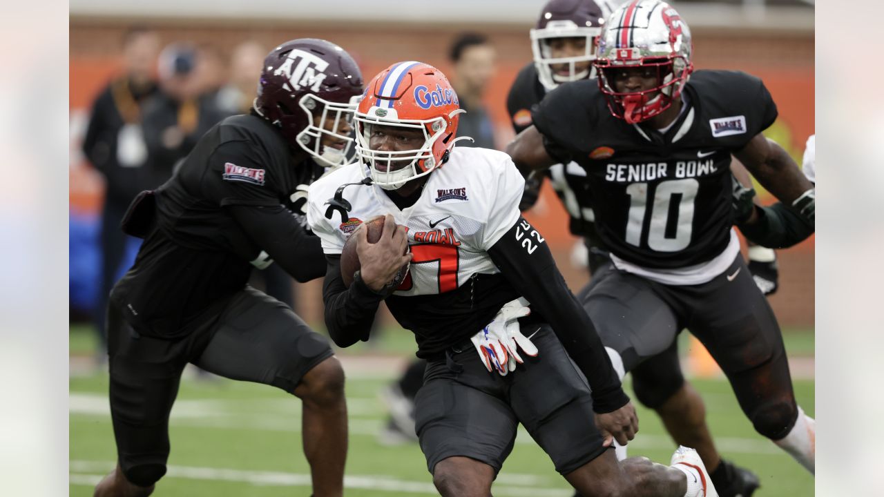 American Team defensive lineman DeAngelo Malone of Western Kentucky (10)  runs through drills during practice for