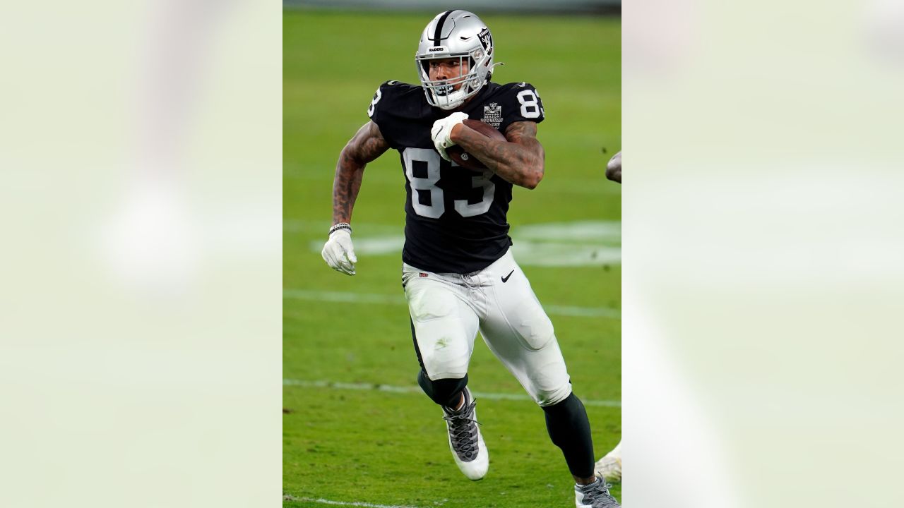 Las Vegas Raiders tight end Darren Waller (83) is tackled by