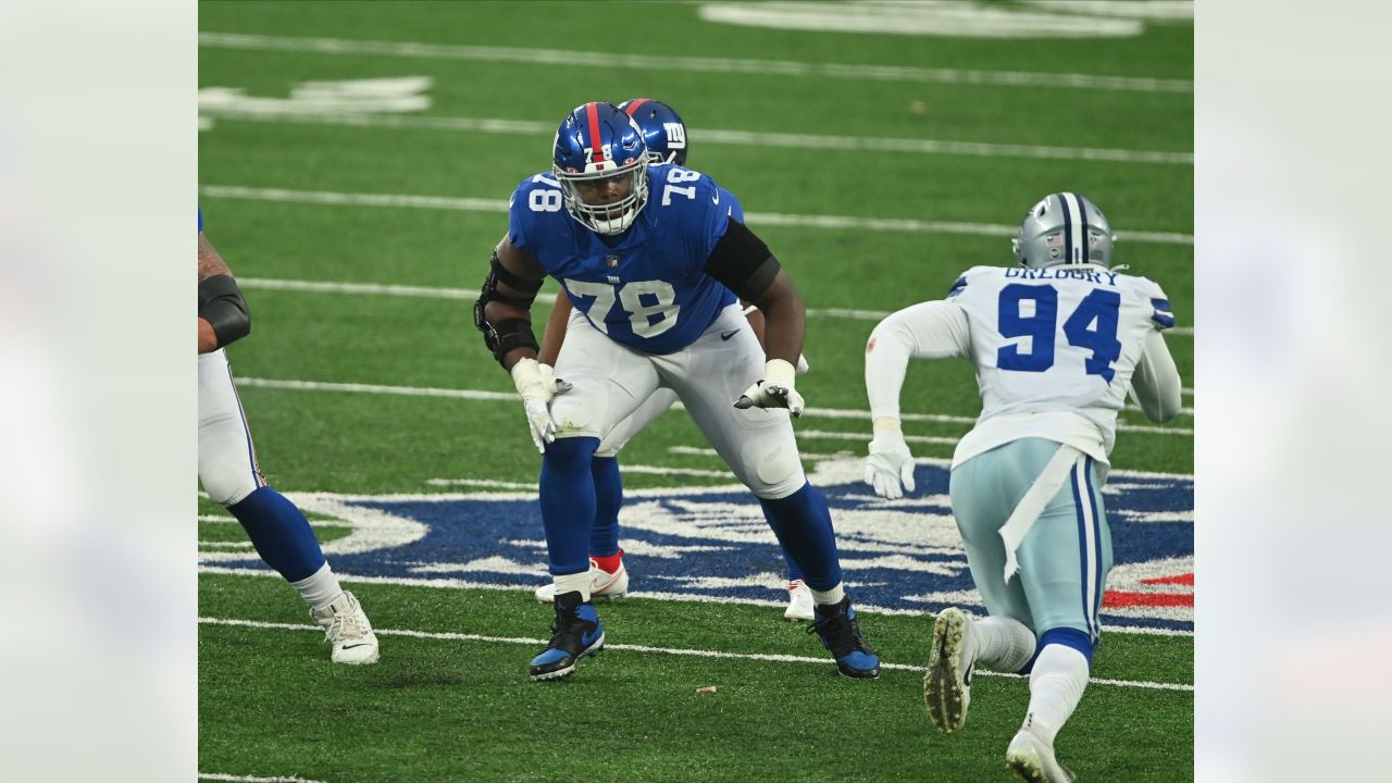 Giants' Evan Neal leaning on All-Pro LT Andrew Thomas, hoping for similar  Year 2 leap