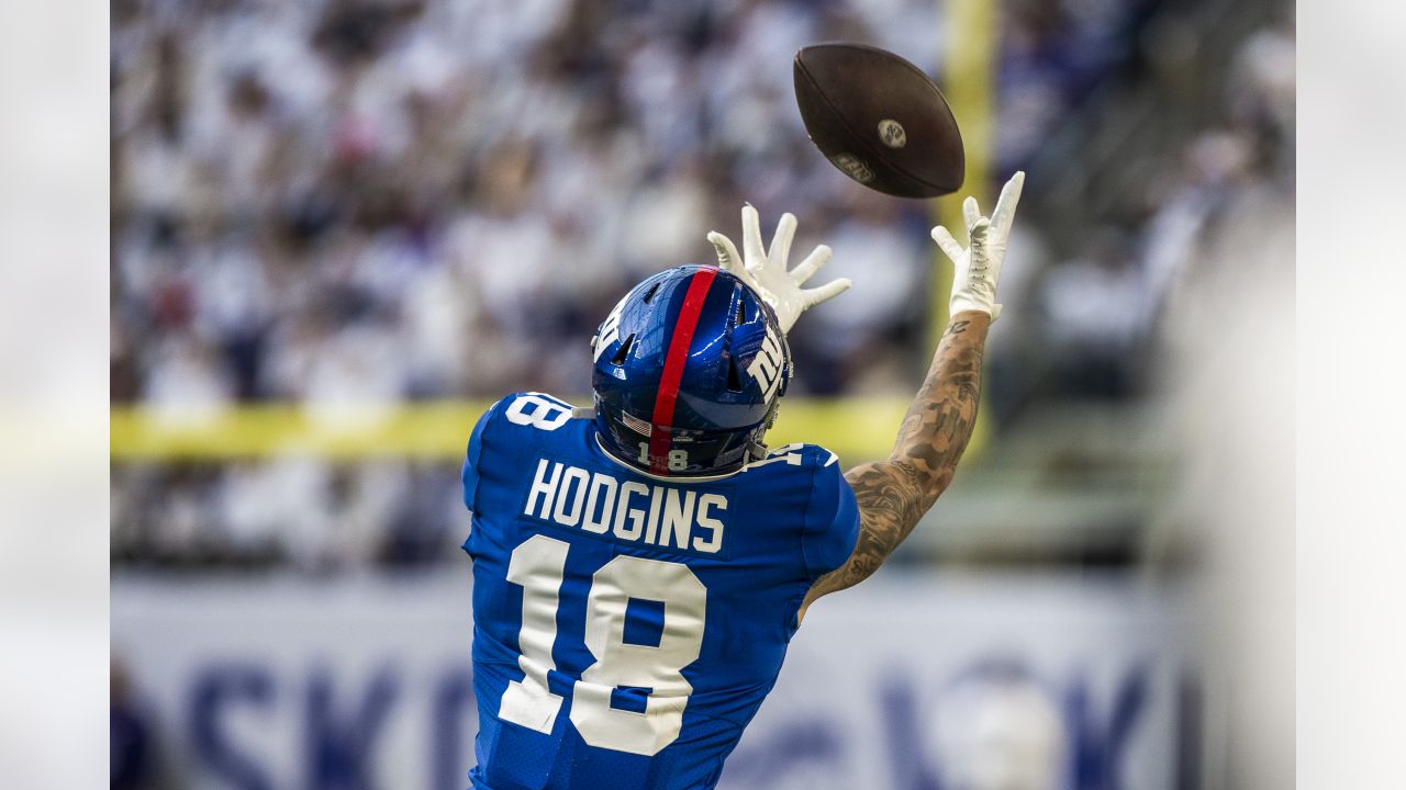 New York Giants wide receiver Isaiah Hodgins (18) runs with the ball  against the Washington Commanders during an NFL football game Sunday, Dec.  4, 2022, in East Rutherford, N.J. (AP Photo/Adam Hunger