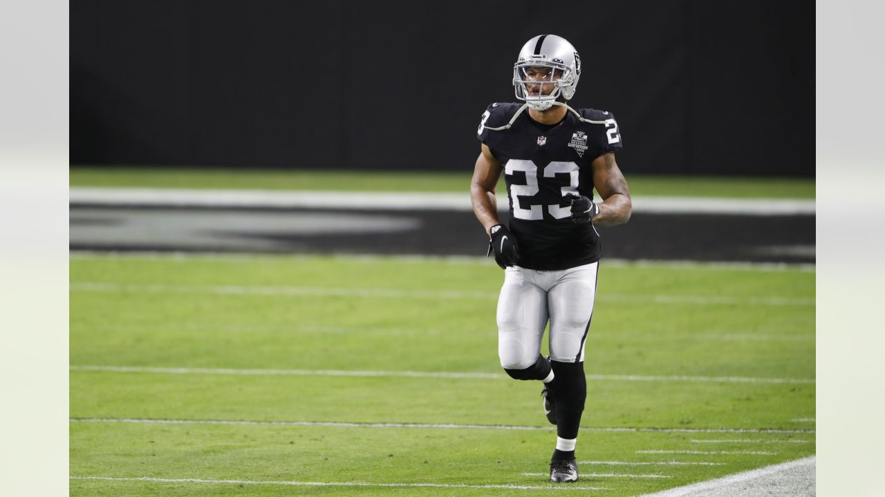 Raiders running back Devontae Booker (23) warms up before the start of an  NFL football game aga …