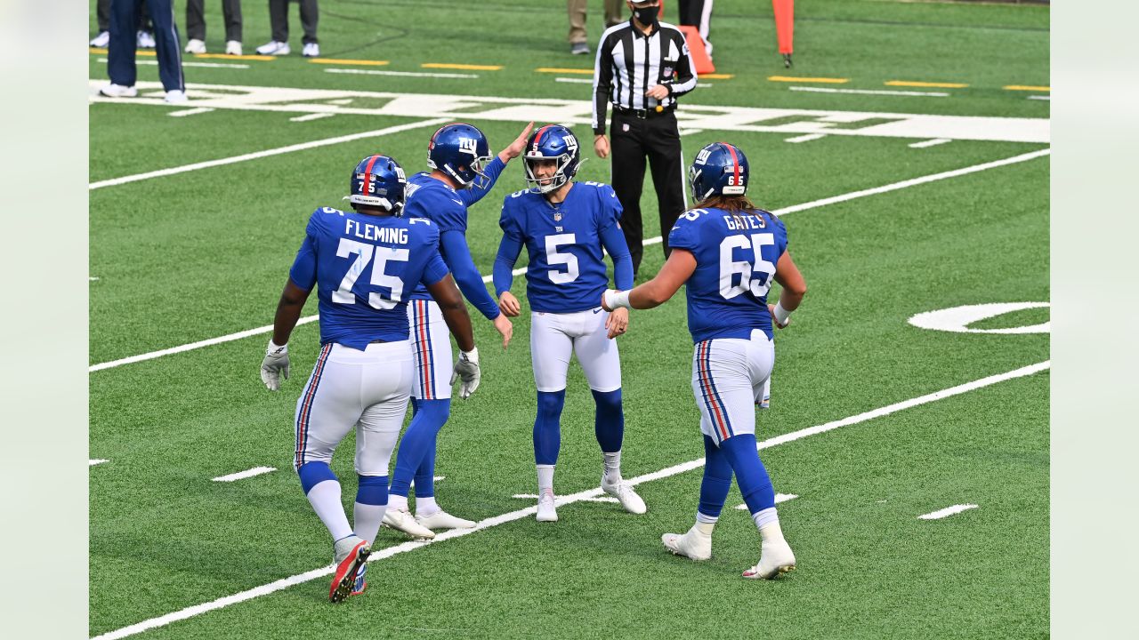 New York Giants kicker Graham Gano (5) gets a pat on the helmet from punter Riley  Dixon (9) after Gano kicked a field goal in the second quarter of an NFL  football