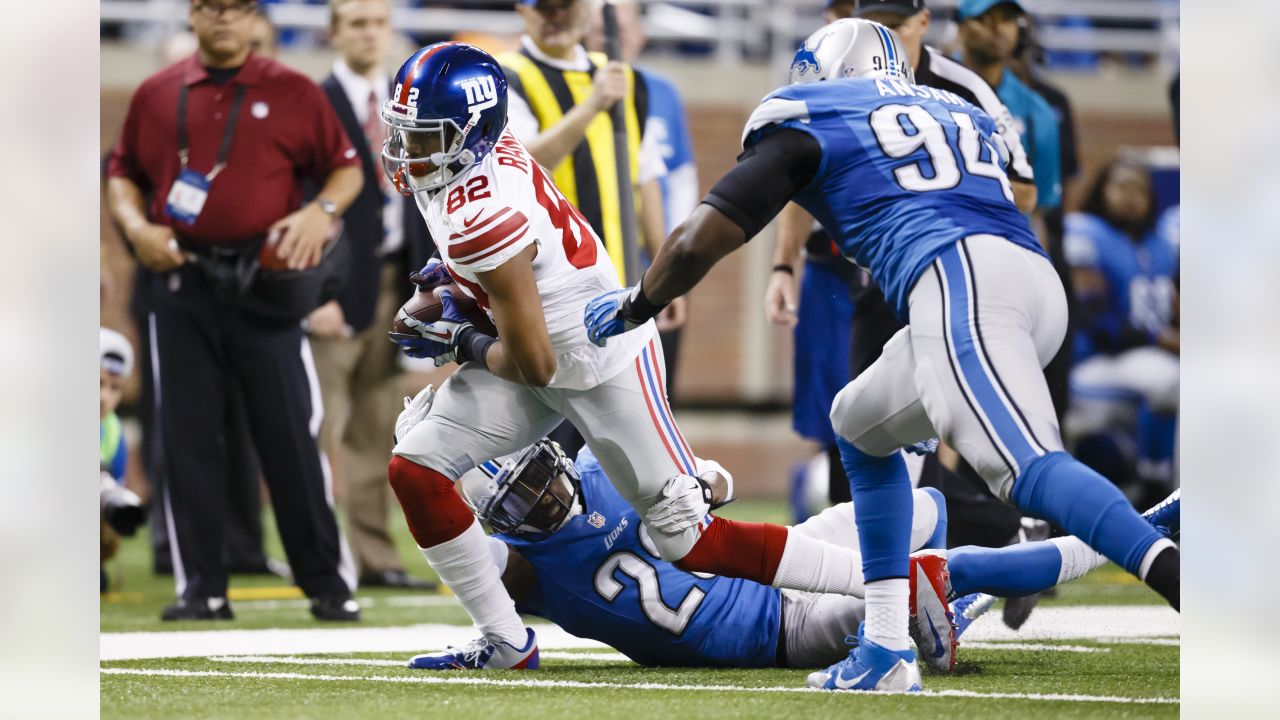 Detroit Lions wide receiver Amon-Ra St. Brown (14) runs the ball against  New York Giants cornerback Rodarius Williams (25) during the second half of  an NFL football game, Sunday, Nov. 20, 2022