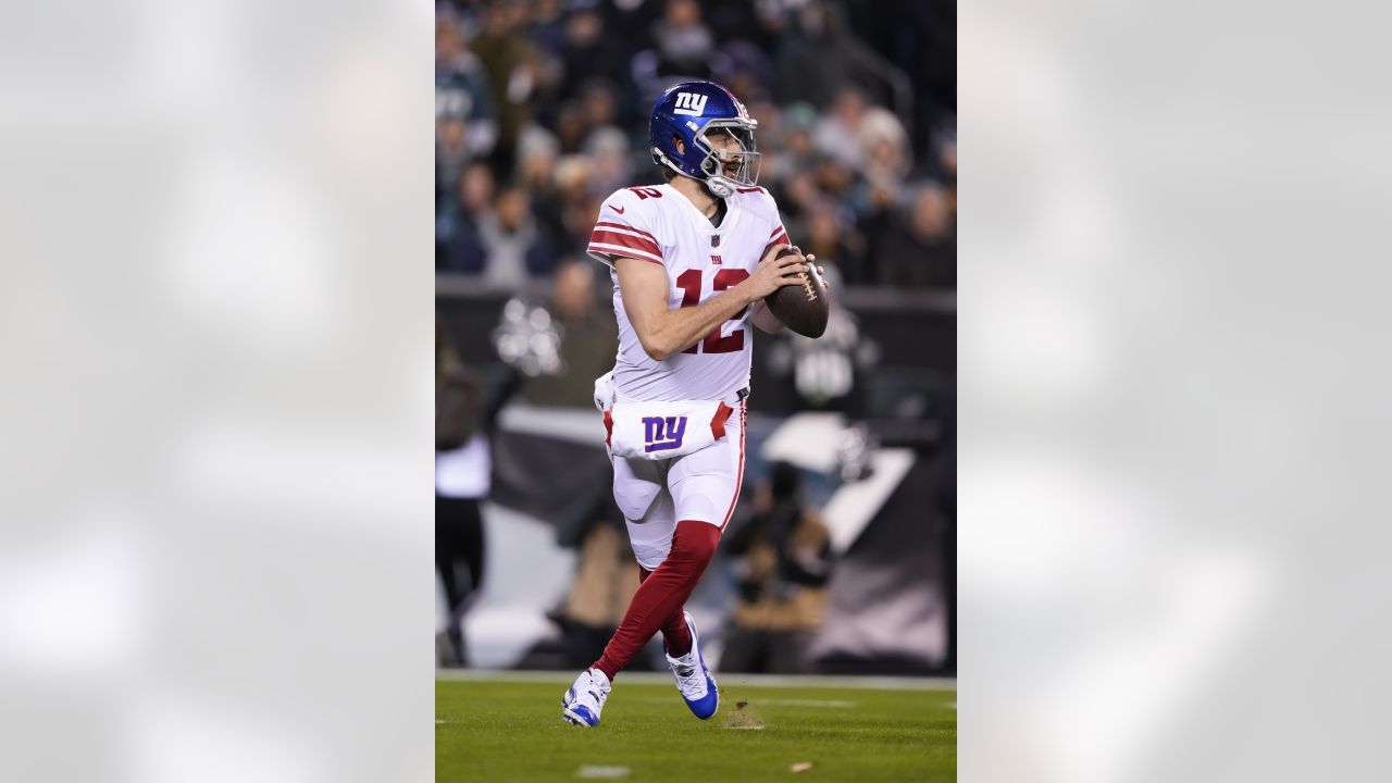 New York Giants quarterback Davis Webb (12) runs over Philadelphia Eagles  safety Reed Blankenship (32) and scores a touchdown on a 14-yard run during  the fourth quarter of an NFL football game