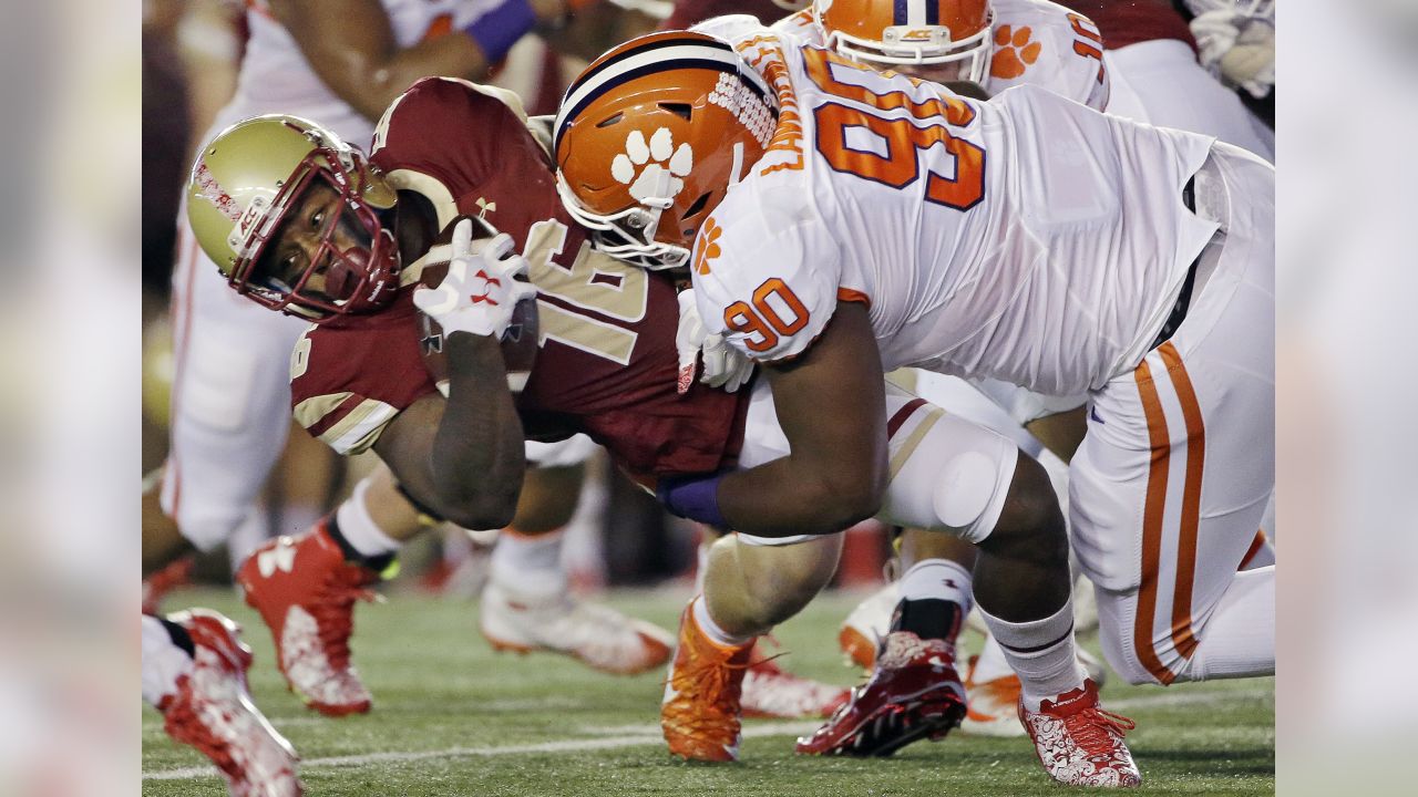 FILE - In this Oct. 7, 2017, file photo, Boston College running back Davon Jones (16) is brought down by Clemson defensive tackle Dexter Lawrence (90) during the first half of an NCAA football game in Boston. Lawrence was selected to the AP All-Conference ACC team announced Tuesday, Dec. 5, 2017. (AP Photo/Elise Amendola, File)