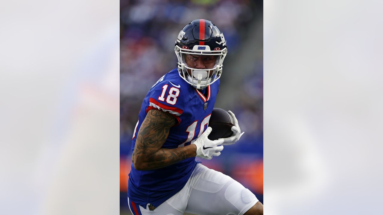 New York Giants wide receiver Isaiah Hodgins (18) runs with the ball  against the Washington Commanders during an NFL football game Sunday, Dec.  4, 2022, in East Rutherford, N.J. (AP Photo/Adam Hunger