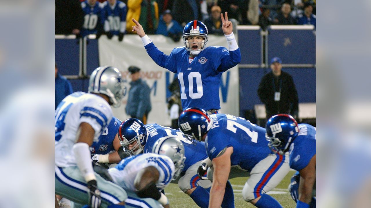 New York Giants Eli Manning releases a pass in week 13 at Giants Stadium in  East Rutherford, New Jersey on December 4, 2005. The New York Giants  defeated the Dallas Cowboys 17-10. (