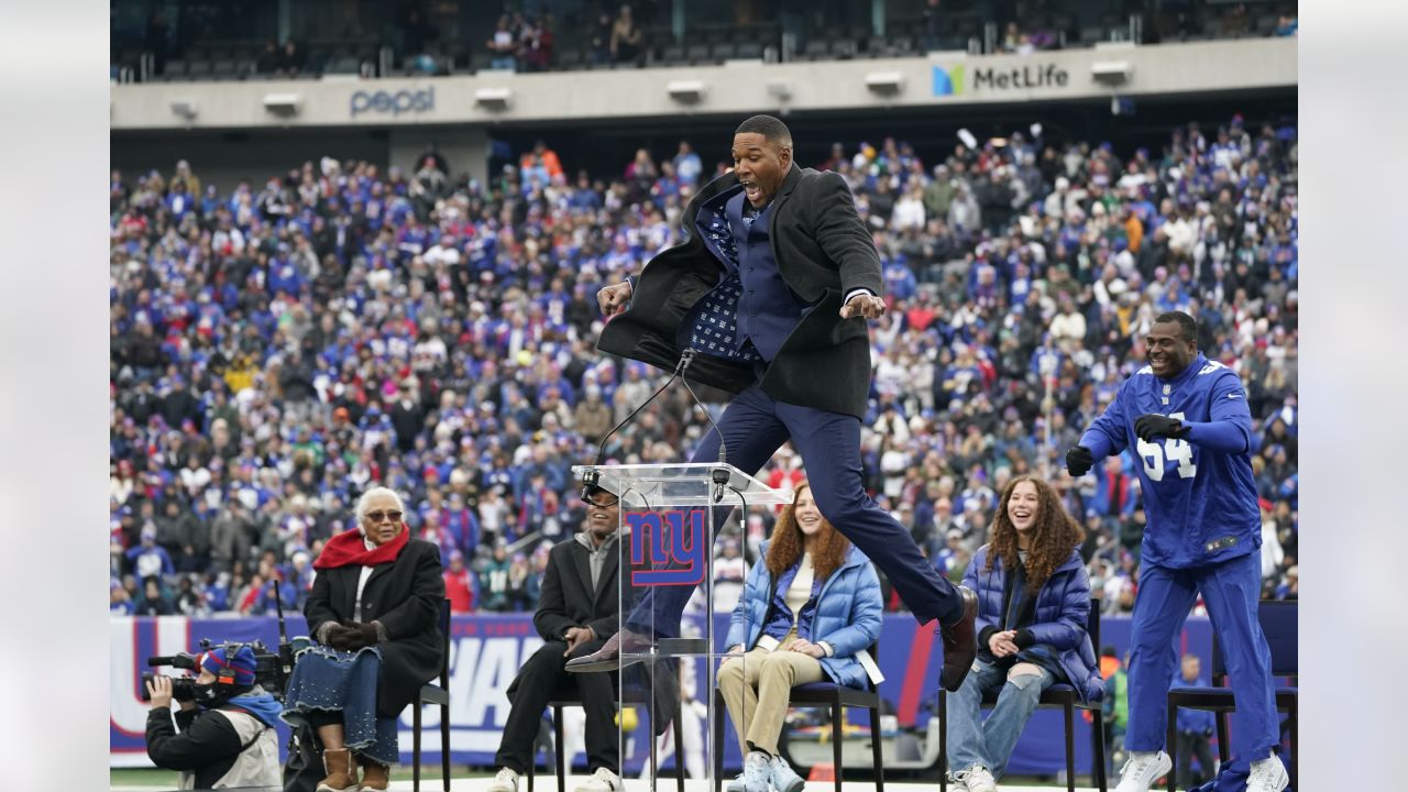 New York Giants Michael Strahan walks away from the podium after his  retirement press conference at Giants Stadium in East Rutherford, New Jersey  on June 6, 2008. Strahan retires after 15 years