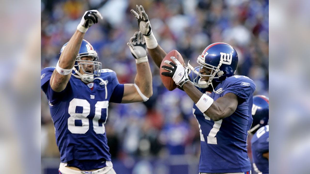 New York Giants Eli Manning puts his hands on his helmet in the 4th quarter  at Giants Stadium in East Rutherford, New Jersey on December 17, 2006. The  Philadelphia Eagles defeated the